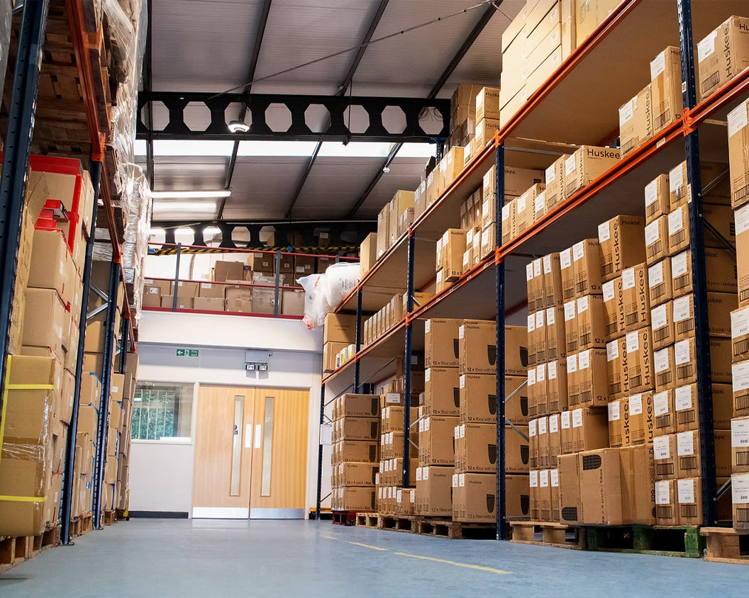 Warehouse stacked with HuskeeCup wholesale packs